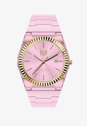 Orologio da polso analogico rosa con lunetta scanalata dorata, indici e lancette dorate, datario e cinturino rosa a maglie.