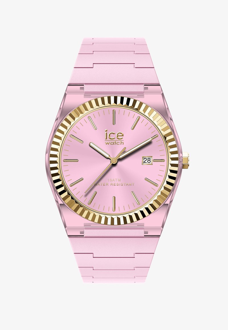 Różowy analogowy zegarek na rękę z złotą ryflowaną ramką, złotymi znacznikami godzin i wskazówkami, wyświetlaczem daty oraz różowym paskiem z ogniwami.