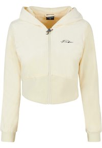 Hoodie court en polaire jaune clair avec fermeture éclair, capuche réglable et branding brodé sur la poitrine. Poignets et ourlet côtelés.