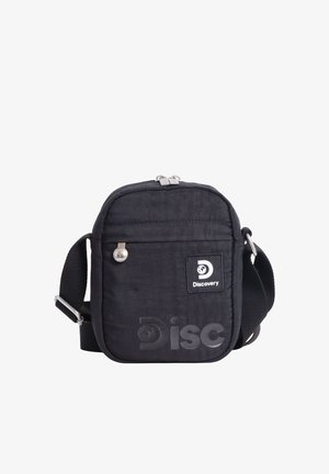 Black compact shoulder bag with adjustable strap, front zip pocket, embossed "Disc" text, and "Discovery" logo patch on the front.