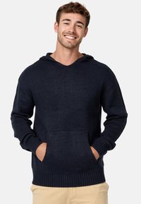 Sweat à capuche bleu marine en tissu tricoté texturé, avec une poche avant, des poignets côtelés et une capuche avec cordon de serrage.