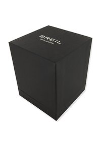 Caja de cartón negra con forma cuadrada, que presenta el nombre de la marca "BREIL" y "NEW SNAKE" grabados en la parte superior con letras blancas.