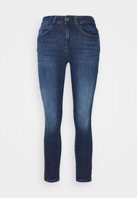 Mörkblå skinny jeans i denim, med en klassisk femfickdesign, synlig sömnad och en lätt blekning på låren.