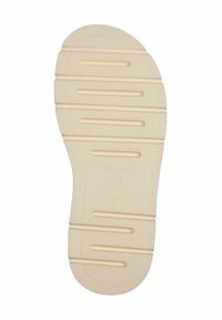 Sole della scarpa color crema con scanalature orizzontali e nervature, dotata di punta arrotondata e logo circolare sopra il numero di taglia 37.