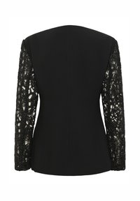 Sort blazer med blonde detaljer på de lange ærmer. Glat stof med en tætsiddende form, der fremhæver komplekse sorte blonde mønstre på ærmeområderne.