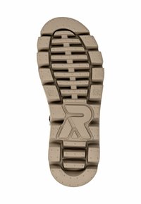 Suela de zapato de goma con un patrón de textura y tacos en color beige. Presenta un logo de marca prominente y la marcación de tamaño 37. Diseño de tacos notable para mejor agarre.