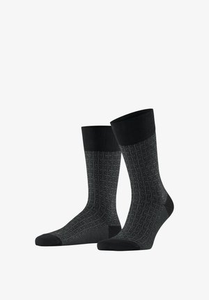 Paire de chaussettes montantes à motifs noirs et gris avec des bordures, orteils et talons noirs unis, présentées sur un modèle de pied invisible.