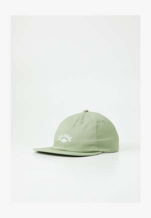 Green cotton baseball cap with a flat brim, featuring embroidered white logo on the front and ventilation eyelets on the crown.