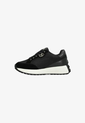 Black mesh and suede athletic sneaker with white sole, metal eyelets, and textured rubber outsole, side view.