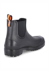 Bottes de cheville en caoutchouc noir avec une semelle texturée, des panneaux latéraux élastiques et un tirant orange rayé à l'arrière. Surface lisse avec un design robuste.