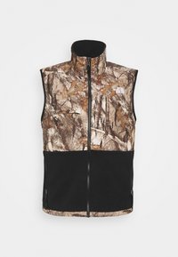 Kamizelka kamuflażowa z zamkiem z przodu i wysokim kołnierzem, w połączeniu brązowych i czarnych tekstur, z logo na górnej lewej stronie.