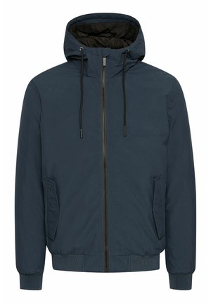 Tamsiai mėlyna kapšas striukė su priekyje įsiūtu užtrauktuku, elastingomis rankovėmis ir juosmeniu bei viena šonine kišene; viduje suteikia juodos pagalvėlės pamušalą.