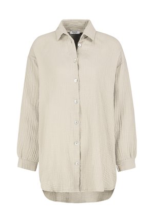 Light beige button-up shirt with a textured, wrinkled fabric. Features a collar, long sleeves with buttoned cuffs, and a curved hem.