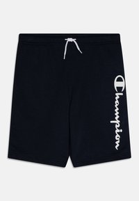 Bañadores de color azul marino oscuro, hechos de tela suave, con un cordón blanco y un destacado logo blanco de "Champion" en el costado.