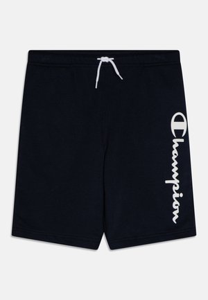 Bañadores de color azul marino oscuro, hechos de tela suave, con un cordón blanco y un destacado logo blanco de "Champion" en el costado.