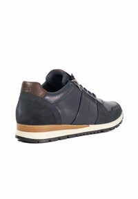 Navy leather and suede sneaker with a brown accent, round toe, lace-up design, and rubber sole with textured tread.