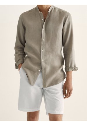 Light gray linen shirt with a Mandarin collar, long sleeves, and button detailing, paired with white shorts. Smooth texture and relaxed fit.