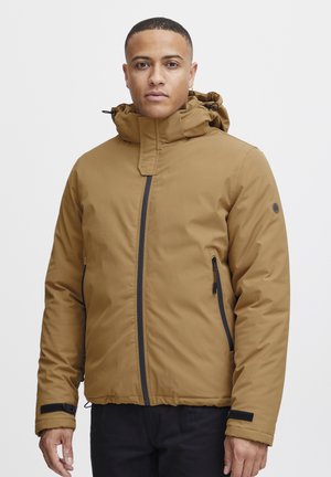 Brown insulated jacket with a high collar, adjustable hood, side zippers, and black accents. Made from smooth, weather-resistant material.