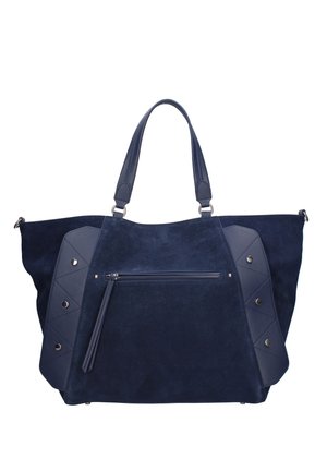 Grand sac cabas en daim bleu marine avec doubles poignées, poche zippée à l'avant et panneaux en cuir décoratifs cousus avec des clous métalliques sur les côtés.