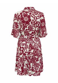 Abito a fiori rosso e bianco con gonna a strati, maniche corte e vita legata. Realizzato in tessuto leggero con una texture morbida.