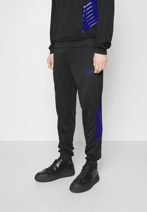 TROUSER - Tracksuit bottoms - dark blue/blue