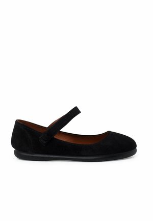 Black suede Mary Jane flat shoes with a rounded toe, adjustable strap, and a smooth rubber sole. Textured upper adds subtle detail.