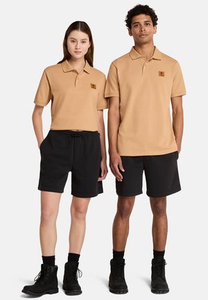 BADGE - Poloshirt - light wheat boot