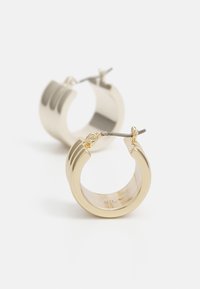 Gold-tone hoop earrings with a polished finish, featuring a textured design and a hinged clasp. Round shape with a glossy surface.