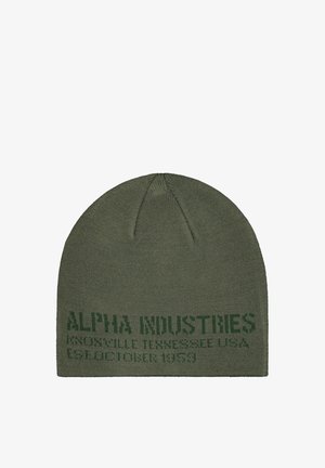 Green knit beanie with dark green text reading Alpha Industries Knoxville Tennessee USA Established 1959 on the lower edge.