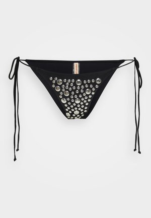 Svart bikini underdel med justerbara knytband på sidorna, som har en klunga av runda rhinestones arrangerade i ett gradientmönster på frampanelen.