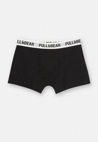 Zwarte katoenen boxershorts met een witte tailleband met de tekst "PULL&BEAR" in zwart. Zachte textuur, aansluitend ontwerp en midden-dij lengte.