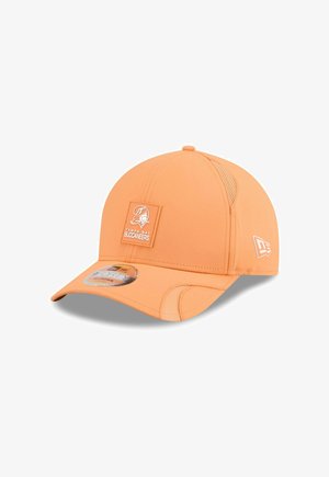 Orange baseball cap with mesh side panels, featuring a square Tampa Bay Buccaneers logo patch on the front and curved brim.
