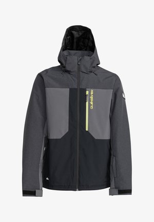 Szary i czarny huśtawka narciarska z kapturem, z zamkniętą kieszenią na piersi, jasną zieloną akcentowaną zamkiem błyskawicznym i regulowanymi mankietami. Posiada teksturowane wykończenie.