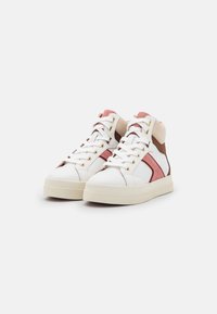 High-top sneakers with white leather and pink suede accents, gold hardware, and a beige back; rubber sole with a textured finish.