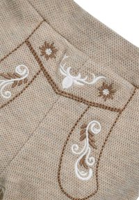 Beige knitted fabric featuring intricate brown and white floral and deer antler embroidery, with textured, woven patterns.