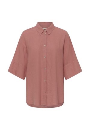 Chemise à manches courtes couleur rose fané avec col classique et tissu ample légèrement texturé.