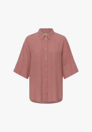 Chemise à manches courtes couleur rose fané avec col classique et tissu ample légèrement texturé.