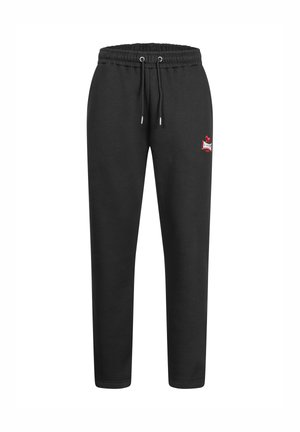 Pantaloni da jogging neri con vita elastica, coulisse regolabile e un piccolo logo rosso sulla coscia sinistra. Tessuto liscio e vestibilità affusolata.