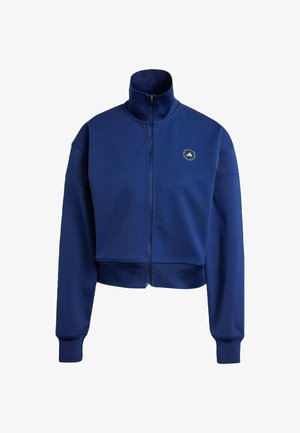 Felpa cropped blu navy con zip e colletto alto, caratterizzata da polsini a coste e un logo rotondo sul petto. Tessuto morbido.