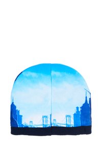 Blue fabric beanie featuring a skyline print, transitioning from light to deep blue, with a navy ribbed cuff at the bottom.