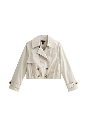 Cream cropped trench coat with double-breasted buttons, wide collar, front flap, side pockets, and buttoned sleeve straps.