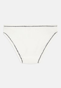Fehér pamut bikini alsó fekete zigzag varrással a széleken. Egyszerű dizájnjával, sima textúrájával és minták nélküli megjelenésével rendelkezik.