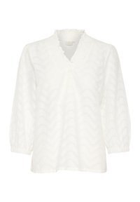 Blouse blanche à manches longues avec un col en V volanté, un motif zigzag texturé et des manches froncées aux poignets. Tissu léger.