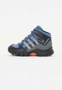 High-top outdoor shoe in blue, gray, and black; textured upper with gray stripes and orange lacing. Traction outsole designed for stability.