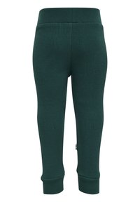 Mörkgröna ribbade leggings med elastiskt midjeband, avsmalnande ärmslut och en liten etikett nära fållen. Mjuk textur och figurnära design.