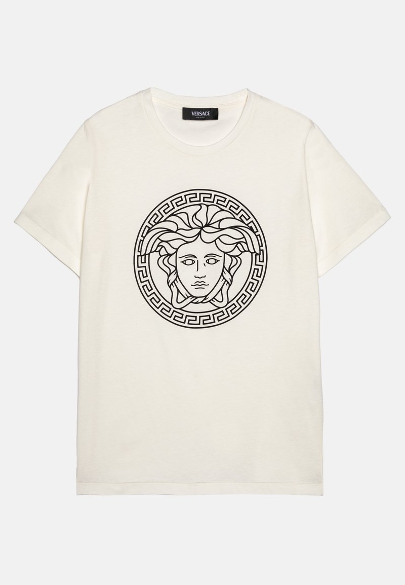 Short-sleeve, cream cotton t-shirt featuring a black Medusa graphic and a circular Greek key border on the front. Classic crew neck design.