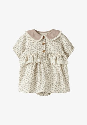 Robe de bébé crème avec petit motif floral marron, bordure en dentelle à volants, boutons en bois et col Peter Pan beige bordé de dentelle.