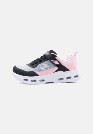 Athletic sneaker in white, pink, and black with mesh upper, hook-and-loop strap, cushioned sole with air pockets, and pull tab at heel.