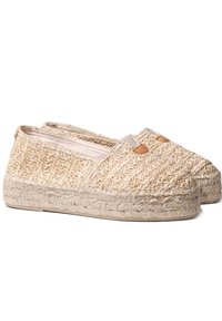 Espadrillas beige intrecciate con una toma in paglia testurizzata, dettagli elastici e suola in juta intrecciata. Punta arrotondata e design piatto.