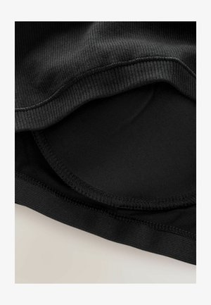 Schwarzes Kleidungsstück aus einem gerippten Stoff mit glattem Innenfutter, mit geschwungenen Nähten und elastischen Kanten. Keine sichtbaren Muster oder Hardware.